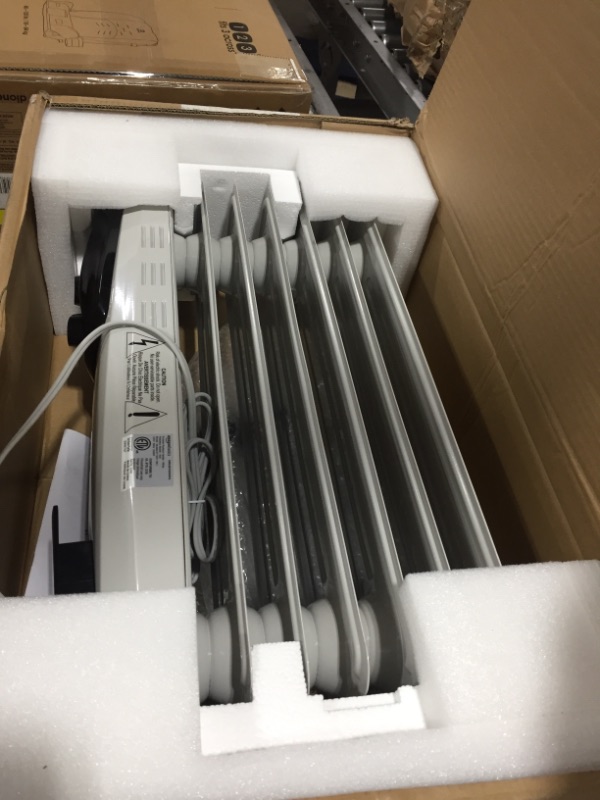 Photo 2 of Amazon Basics Indoor Portable Radiator Heater - White
