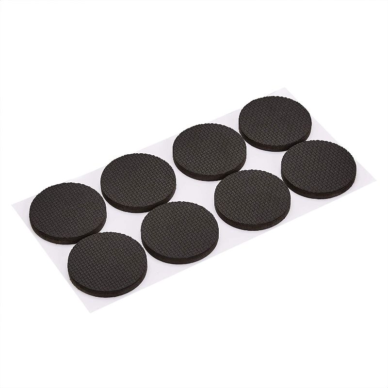 Photo 1 of Amazon Basics Rubber Furniture Pads, Black, 2'' Round, 8 pcs
