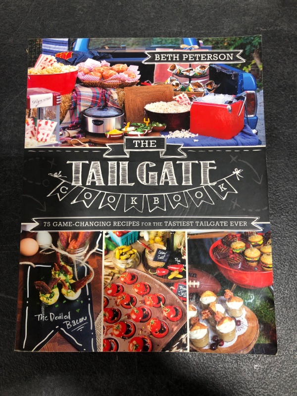 Photo 2 of The Tailgate Cookbook: 75 Game-changing Recipes for the Tastiest Tailgate Ever Paperback – Illustrated, August 14, 2018
USED CONDITION.