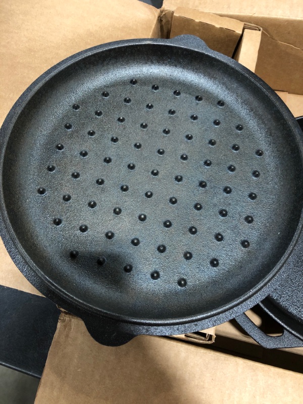 Photo 4 of Cast Iron Skillet - 12"-Inch Frying Pan with Assist Handle and Pour Spots + Silicone Grip Cover - Pre-Seasoned Oven Safe Cookware - Indoor/Outdoor Use - Grill, Stovetop, Induction and Firepit Safe
PRIOR USE.
