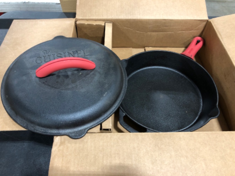 Photo 2 of Cast Iron Skillet - 12"-Inch Frying Pan with Assist Handle and Pour Spots + Silicone Grip Cover - Pre-Seasoned Oven Safe Cookware - Indoor/Outdoor Use - Grill, Stovetop, Induction and Firepit Safe
PRIOR USE.
