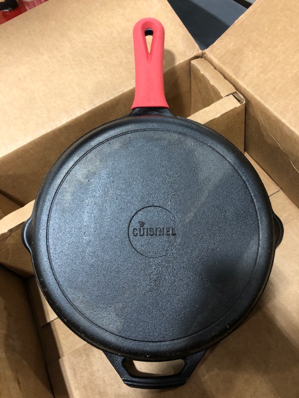 Photo 5 of Cast Iron Skillet - 12"-Inch Frying Pan with Assist Handle and Pour Spots + Silicone Grip Cover - Pre-Seasoned Oven Safe Cookware - Indoor/Outdoor Use - Grill, Stovetop, Induction and Firepit Safe
PRIOR USE.
