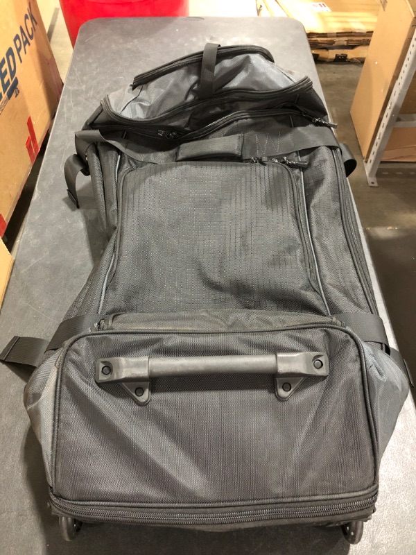 Photo 3 of Amazon Basics Ripstop Wheeled Duffel, 30"
PRIOR USE.