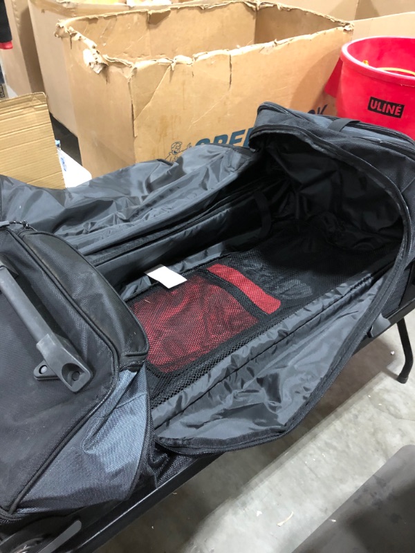 Photo 5 of Amazon Basics Ripstop Wheeled Duffel, 30"
PRIOR USE.