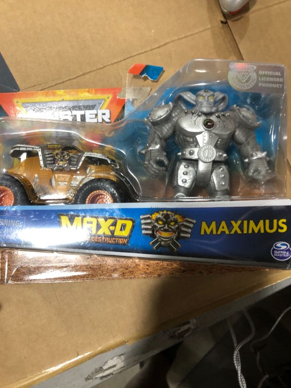 Photo 2 of Monster Jam, Official Max-D 1:64 Scale Monster Truck and 5-Inch Maximus Creatures Action Figure Set
