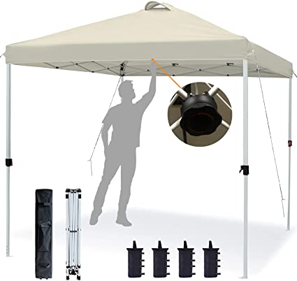 Photo 1 of ASTEROUTDOOR 10'x10' Pop Up Canopy with Adjustable Leg Heights Wheeled Carry Bag, Sandbags, Stakes and Ropes, Beige
