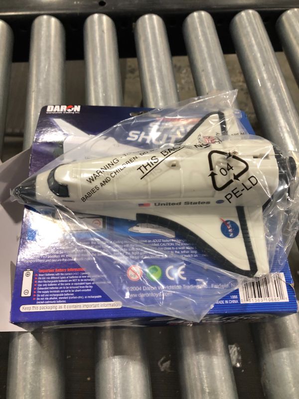 Photo 1 of Flying Space Shuttle On A String
