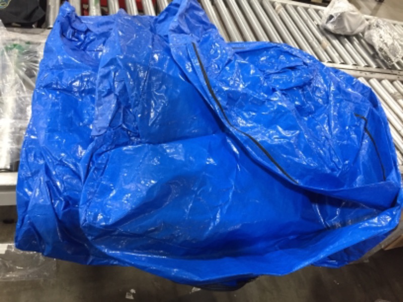 Photo 1 of Blue tarp size unknown with zippers 