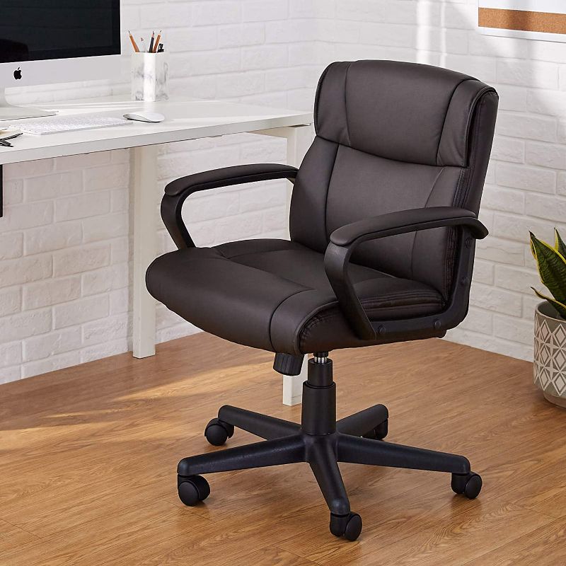 Photo 1 of Amazon Basics Padded Office Desk Chair with Armrests, Adjustable Height/Tilt, 360-Degree Swivel, 275Lb Capacity - Dark Brown