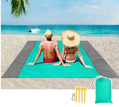 Photo 1 of Beach Blanket, Large Sandproof Beach Mat for 4-7 Adults, Waterproof Pocket Picnic Blanket with 4 Stakes, Outdoor Blanket for Travel, Camping, Hiking with Storage Bag(83" X 78")
