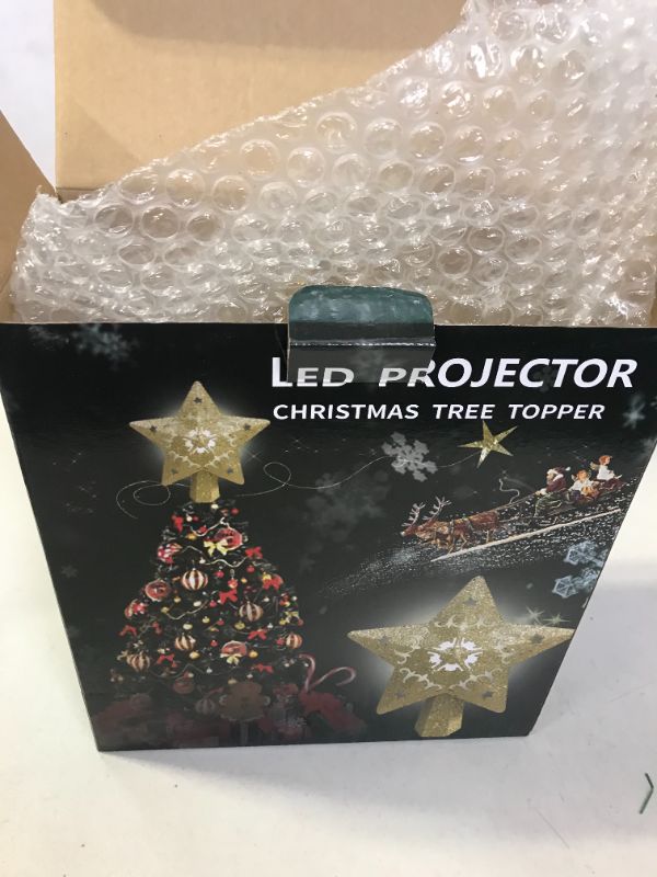 Photo 3 of Christmas Star Tree Topper with LED Projector, Lighted Tree Topper with Rotating Warm Star Shape Lights, 3D Hollow Gold Star Xmas Tree Topper for Christmas Tree Decorations
