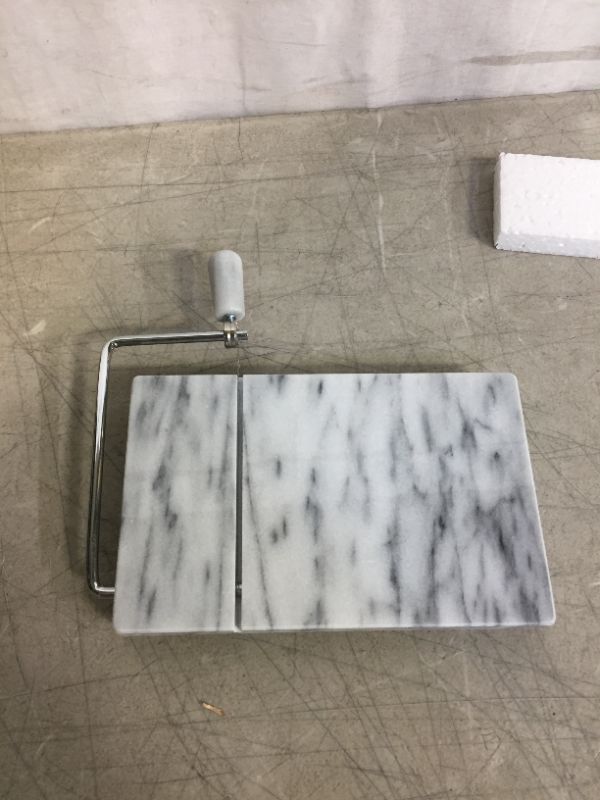 Photo 4 of RSVP International White Marble Cheese Slicer & Cutting Board, 5" x 8" | Cut Cheeses, Meats, & Other Appetizers | Each Piece Unique in Marble Coloring | Cut & Slice with Elegance
