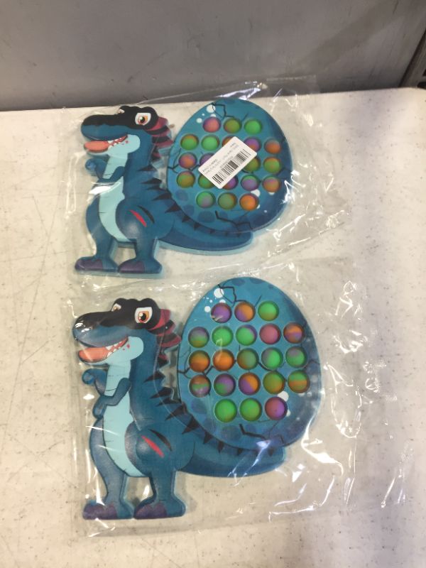 Photo 1 of 2 pack fidget popper dinosaur (Easter)