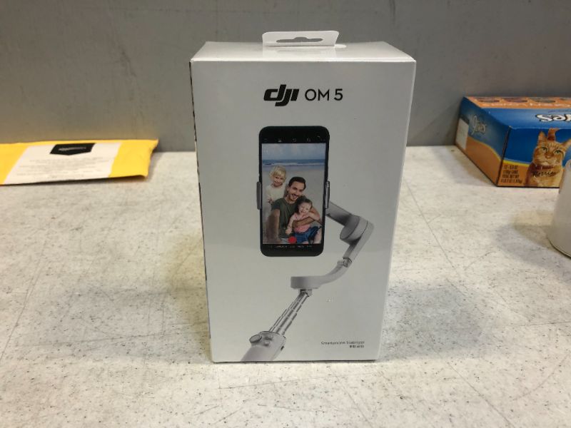 Photo 2 of DJI OM 5 Smartphone Gimbal Stabilizer, 3-Axis Phone Gimbal, Built-In Extension Rod, Portable and Foldable, Android and iPhone Gimbal with ShotGuides, Vlogging Stabilizer, YouTube TikTok Video, Gray -- Factory Sealed