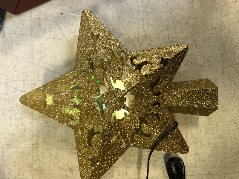Photo 3 of Christmas Tree Topper Lighted 3D Hollow Golden Star with Rotating Projection Light for Christmas Decor , Christmas Tree Topper Star Project Dynamic Colorful Stars and Stable Enough

