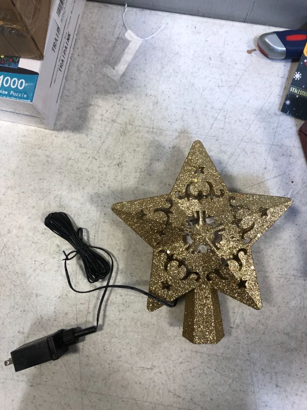 Photo 2 of Christmas Tree Topper Lighted 3D Hollow Golden Star with Rotating Projection Light for Christmas Decor , Christmas Tree Topper Star Project Dynamic Colorful Stars and Stable Enough

