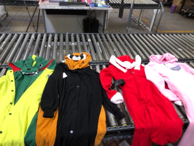 Photo 1 of ASSORTED ONESIES, SIZES FROM LEFT TO RIGHT. XLARGE, M, L, L.