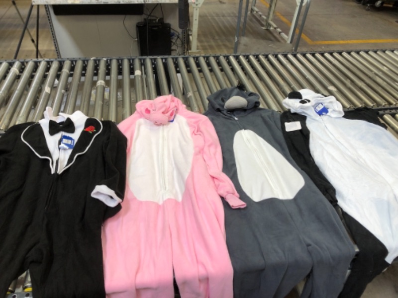 Photo 1 of ASSORTED ONESIES, SIZES FROM LEFT TO RIGHT. M, XLARGE, LARGE, SMALL.