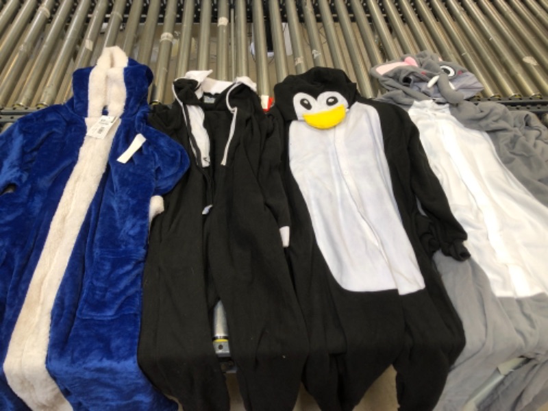 Photo 1 of ASSORTED ONESIES, SIZES FROM LEFT TO RIGHT. XXXL, LARGE, SMALL, XL.