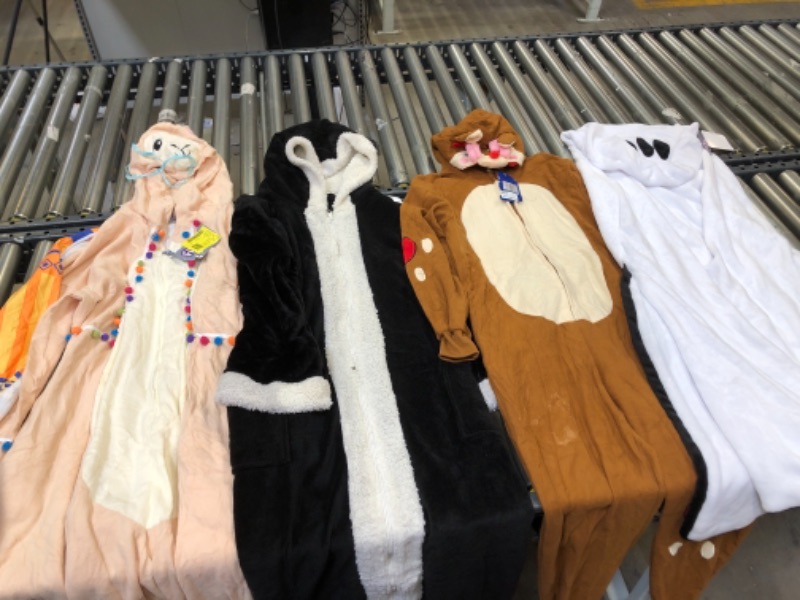 Photo 1 of ASSORTED ONESIES, SIZES FROM LEFT TO RIGHT. MEDIUM, XXL, MEDIUM, MEDIUM.