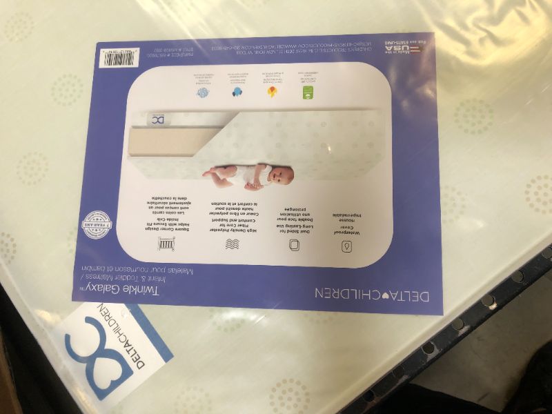 Photo 1 of Delta Children Twinkle Galaxy Dual Sided Crib and Toddler Mattress - Premium Sustainably Sourced Fiber Core - Waterproof - GREENGUARD Gold Certified (Non-Toxic) - 7 Year Warranty - Made in USA
