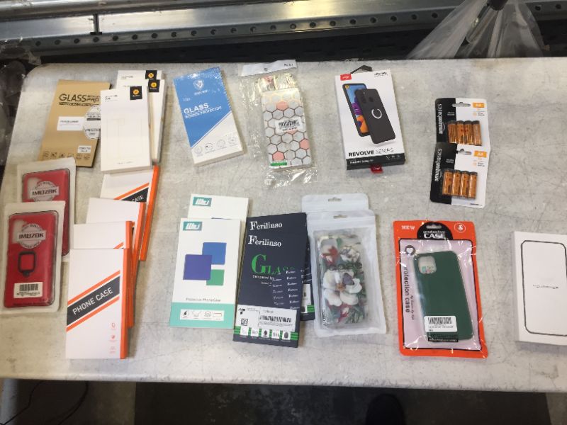 Photo 1 of variety of phone cases and screen protectors with AA batteries 