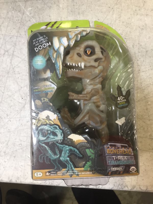 Photo 1 of WowWee Untamed Skeleton T-Rex by Fingerlings – Doom (Ash) – Interactive Collectible Dinosaur
