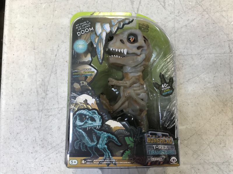 Photo 2 of WowWee Untamed Skeleton T-Rex by Fingerlings – Doom (Ash) – Interactive Collectible Dinosaur
