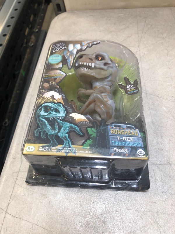 Photo 1 of WowWee Untamed Skeleton T-Rex by Fingerlings – Doom (Ash) – Interactive Collectible Dinosaur
