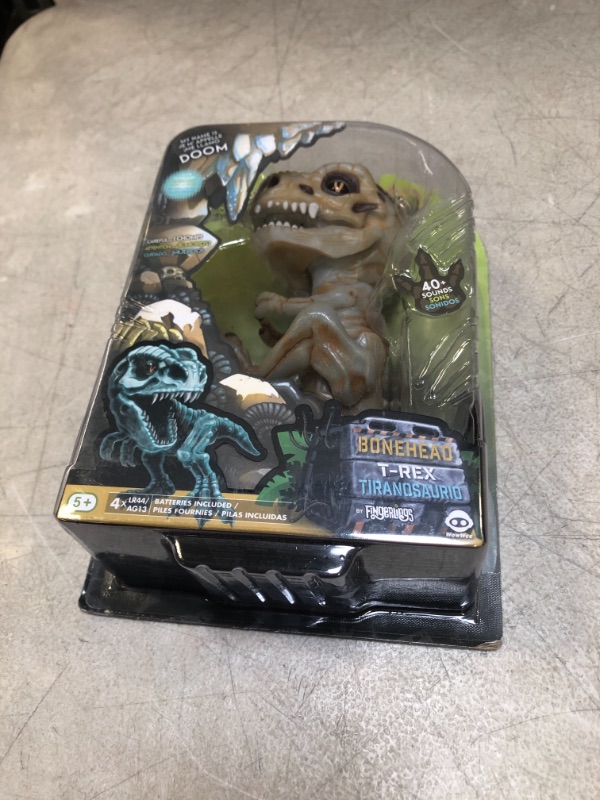 Photo 2 of WowWee Untamed Skeleton T-Rex by Fingerlings – Doom (Ash) – Interactive Collectible Dinosaur

