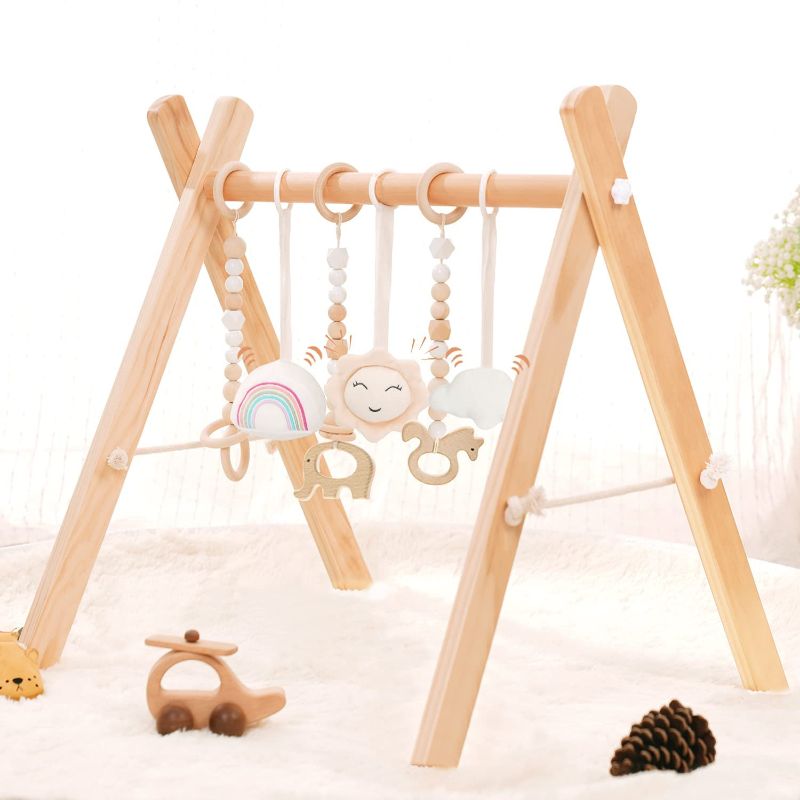 Photo 1 of Wooden Baby Gym with 6 Wooden Baby Toys Foldable Baby Play Gym Frame Activity Gym Hanging Bar Newborn Gift Baby Girl and Boy Gym (Natural Color)