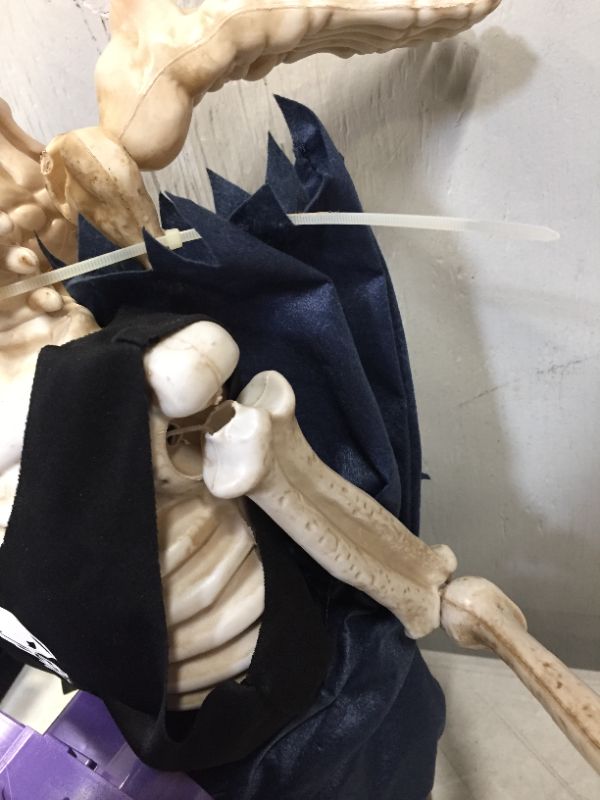 Photo 1 of 37inch Voice-Activated Skeleton Skull, Indoor/Outdoor Halloween Decoration,Sit on The Fireplace and Play The Guitar,Creepy Tabletop Decor (minor damage to arm)(needs batteries)