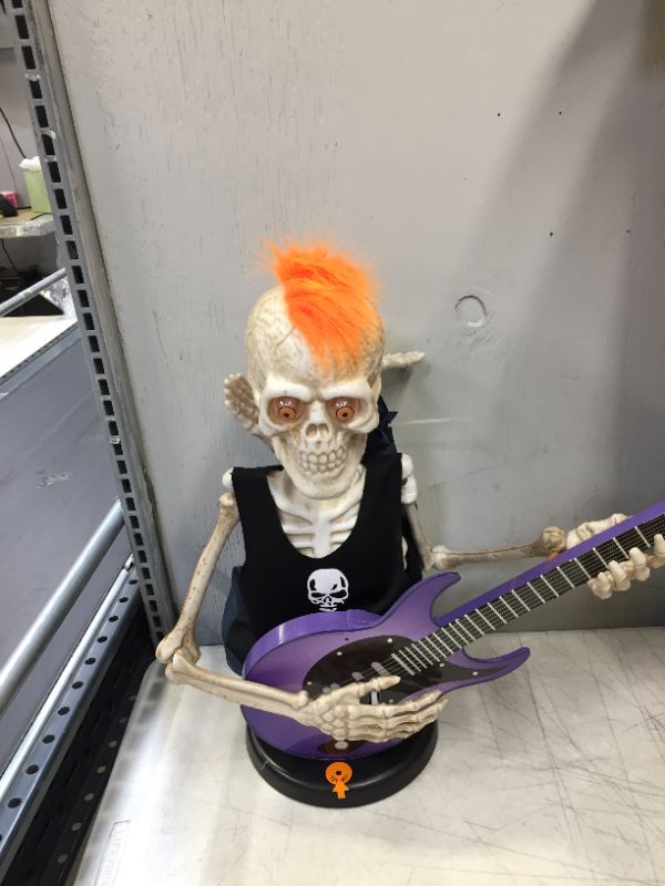 Photo 4 of 37inch Voice-Activated Skeleton Skull, Indoor/Outdoor Halloween Decoration,Sit on The Fireplace and Play The Guitar,Creepy Tabletop Decor (minor damage to arm)(needs batteries)