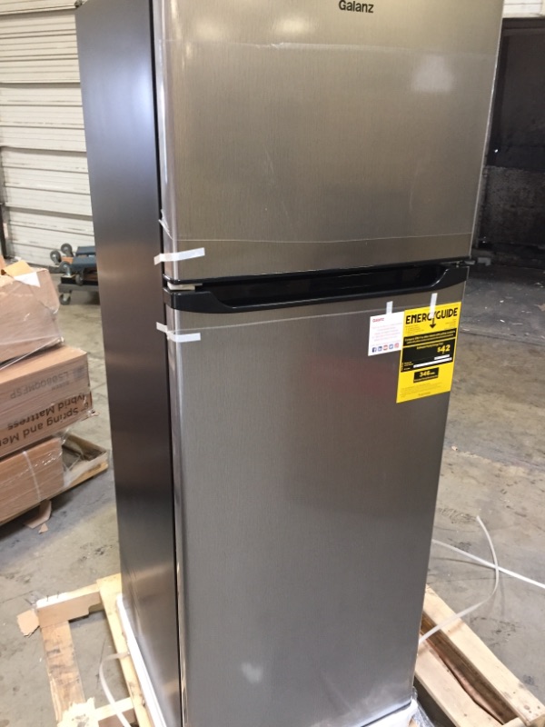 Photo 2 of Galanz 12 Cu Ft Top Freezer Refrigerator, Frost Free, Stainless Look
FACTORY WRAPPED PRIOR TO PICTURES 
ON ONE SIDE THERE IS 2 DENTS BUT THEY DO NOT EFFECT FUNCTION 