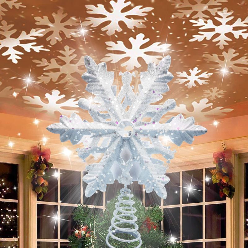 Photo 1 of Christmas Tree Topper with 3D Snowflake Projector Lights, 11.6" Snowflake Tree Topper Light Decorations, Indoor Outdoor Fantastic Rotating Projector Lights for New Year Holiday Christmas Tree (White)
