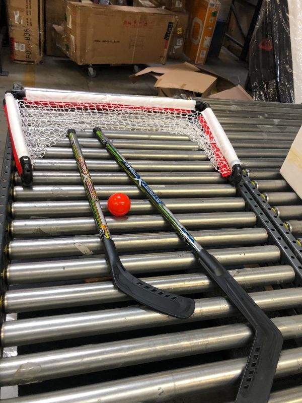 Photo 2 of Franklin Sports NHL Youth Street Hockey Set - (2) Kids Junior Hockey Sticks, PVC Goal + Roller Hockey Ball Included - Indoor + Outdoor Net - 46"
