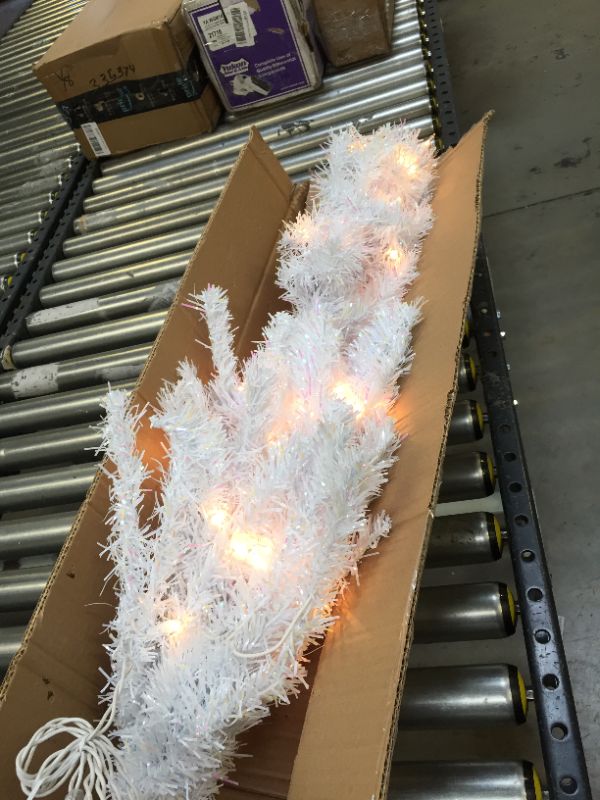 Photo 3 of National Tree Company Pre-Lit Artificial Christmas Tree, White Tinsel, White Lights, Includes Stand, 4 feet
