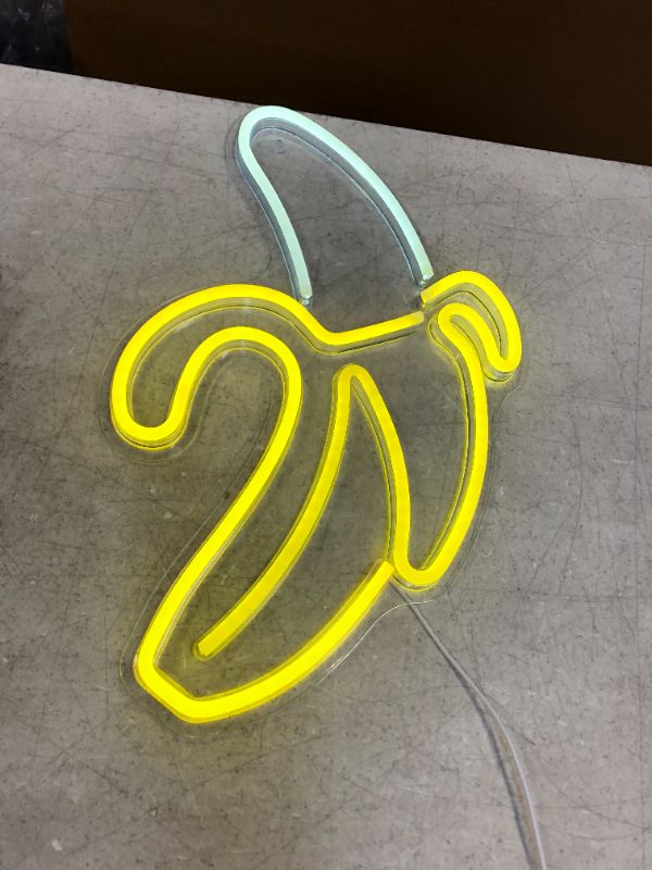 Photo 1 of peeled banana neon sign