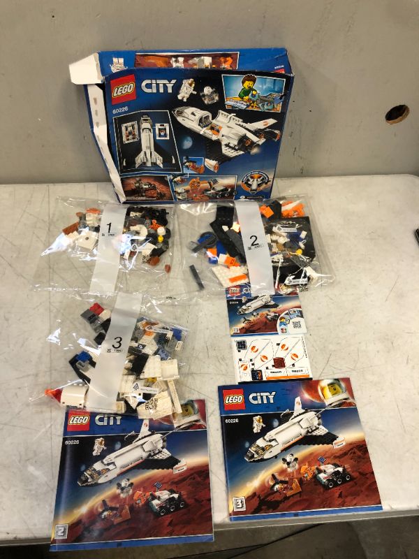 Photo 2 of LEGO City Space Mars Research Shuttle 60226 Space Shuttle Toy Building Kit with Mars Rover and Astronaut Minifigures, Top STEM Toy for Boys and Girls (273 Pieces)-----package already open/damage but appears new