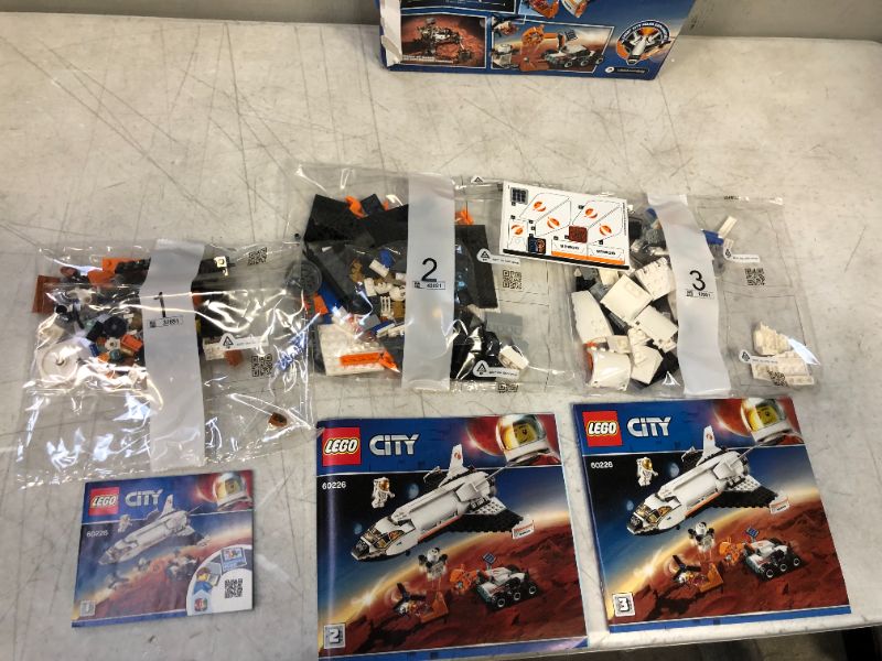 Photo 3 of LEGO City Space Mars Research Shuttle 60226 Space Shuttle Toy Building Kit with Mars Rover and Astronaut Minifigures, Top STEM Toy for Boys and Girls (273 Pieces)-----package already open/damage but appears new