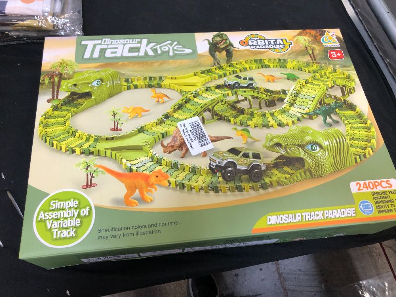 Photo 2 of Dinosaur Toys,Wuayur 240pcs Dinosaur Theme World Race Toy Set for Kids,240 Flexible Track Playset ,2 Cars,8 Dinosaurs and 2 Dinosaur Heads, Christmas Birthday Gift for 3 4 5 6 7 Year Old boy Girls