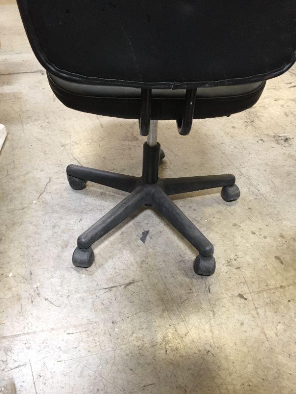 Photo 1 of 36 INCH TALL BLACK LEATHER CHAIR ON WHEELS.