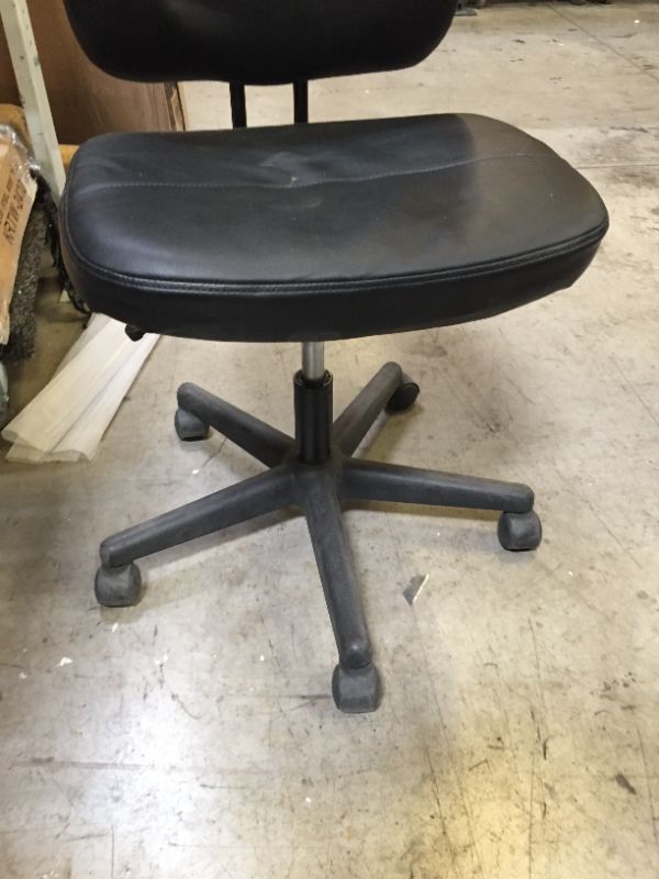 Photo 1 of 36 INCH TALL BLACK LEATHER CHAIR ON WHEELS.