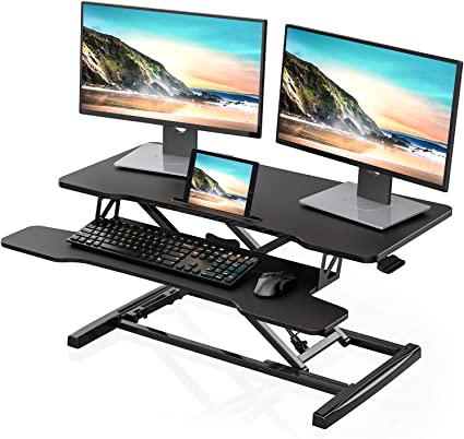 Photo 1 of FITUEYES Height Adjustable Standing Desk Converter 36” Wide Sit to Stand Up Desk Tabletop Workstation with Wide Keybroad Tray Black SD309101WB
