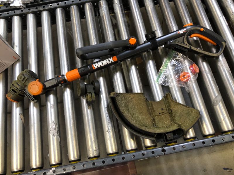 Photo 2 of WORX WG170 GT Revolution 20V 12 Inch Grass Trimmer/Edger/Mini-Mower 2 Batteries & Charger Included, Black and Orange