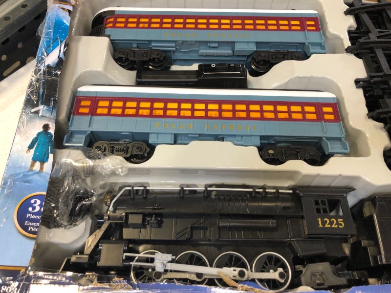 Photo 5 of Lionel The Polar Express battery-powered Train Set with Remote + 12-Piece Straight Track Expansion Pack
