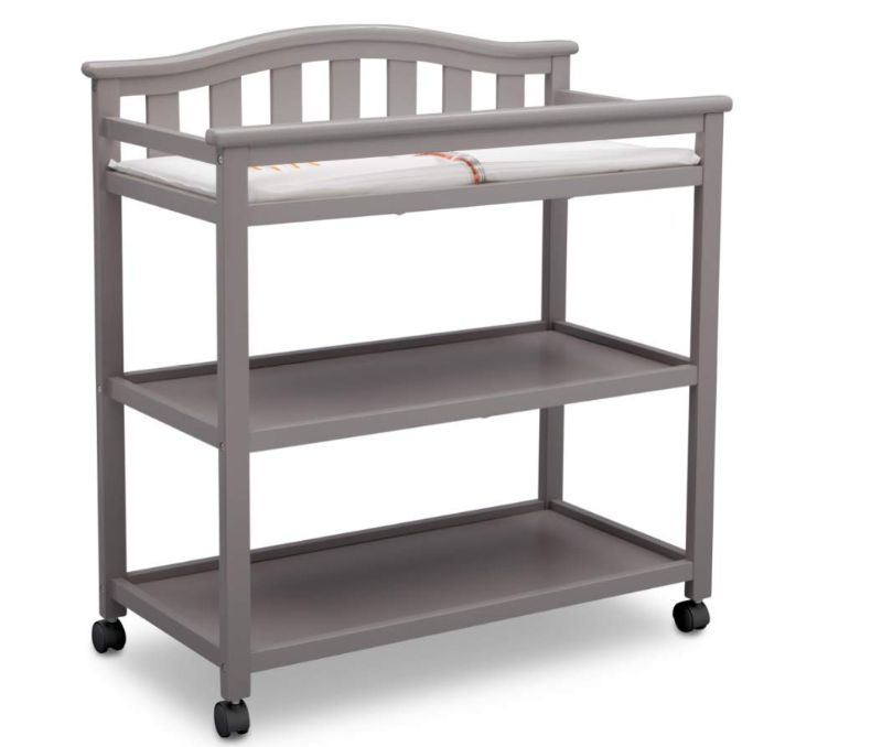 Photo 1 of Delta Children Bell Top Changing Table with Wheels and Changing Pad, Grey
