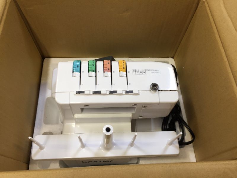 Photo 1 of Brother Serger, 1034D, Heavy-Duty Metal Frame Overlock Machine, 1,300 Stitches Per Minute, Removeable Trim Trap, 3 Included Accessory Feet,White
