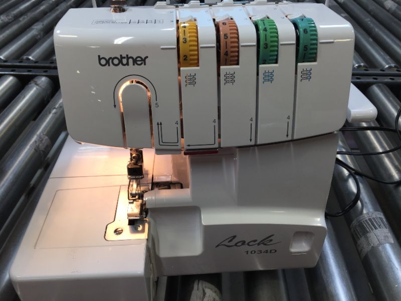 Photo 4 of Brother Serger, 1034D, Heavy-Duty Metal Frame Overlock Machine, 1,300 Stitches Per Minute, Removeable Trim Trap, 3 Included Accessory Feet,White
