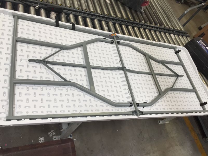 Photo 1 of 29" X 70" folding table 